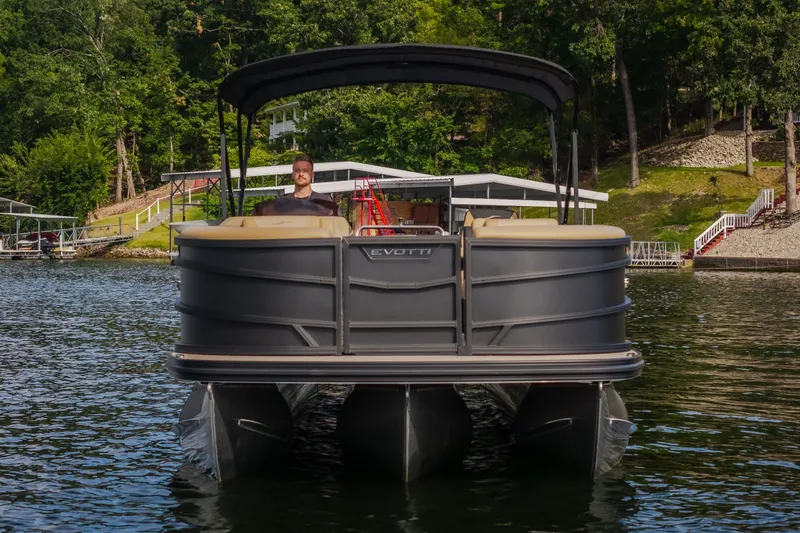 Slide: The Image of 2026 Evotti 525QL pontoon boat on a serene lake with lush greenery. - 24