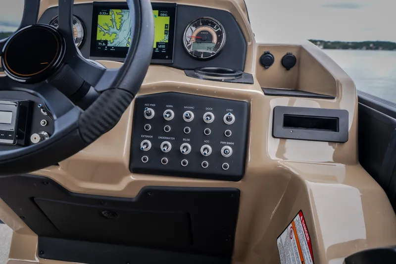 Slide: The Image of Dashboard of 2026 Evotti 525QL boat with steering wheel and control panel. - 36