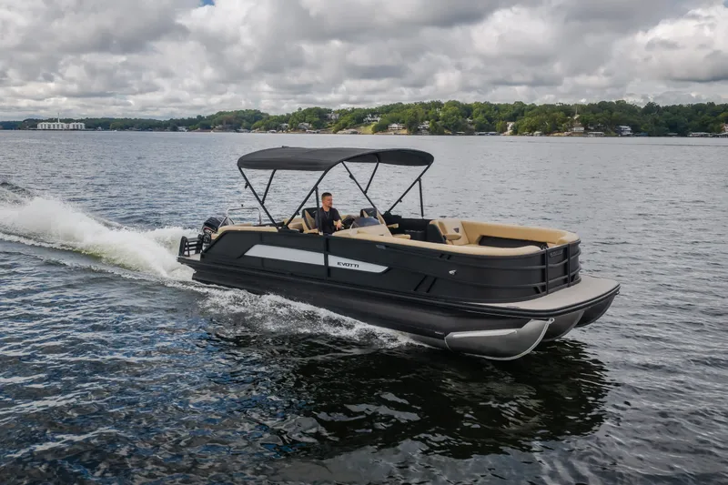 Slide: The Image of Evotti 525QL 2026 pontoon boat cruising on a lake under cloudy skies. - 66