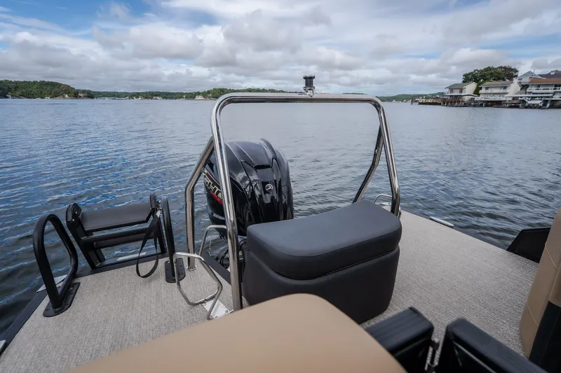 Slide: The Image of Evotti 525QL 2026 pontoon boat on a serene lake with scenic views. - 55