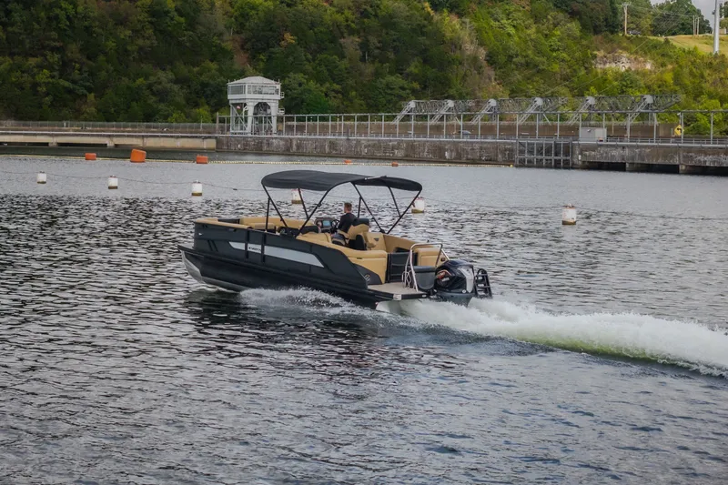 Slide: The Image of Evotti 525QL boat cruising on a scenic lake, 2026 model. - 72