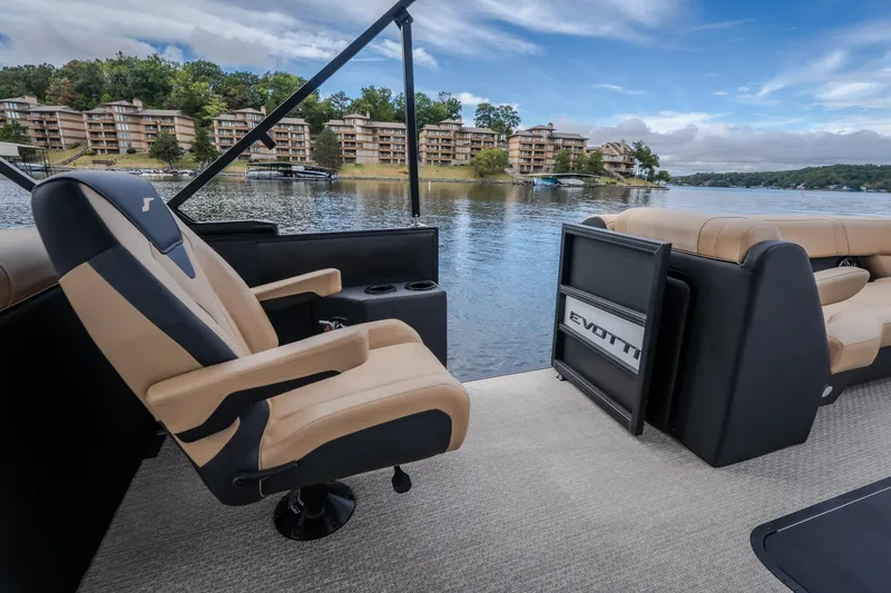 Slide: The Image of 2026 Evotti 525QL boat interior with luxurious seating, overlooking a scenic lakeside view. - 40