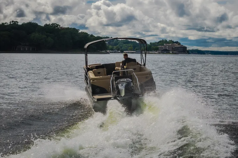 Slide: The Image of Evotti 525QL boat cruising on a lake, 2026 model, with scenic background. - 73