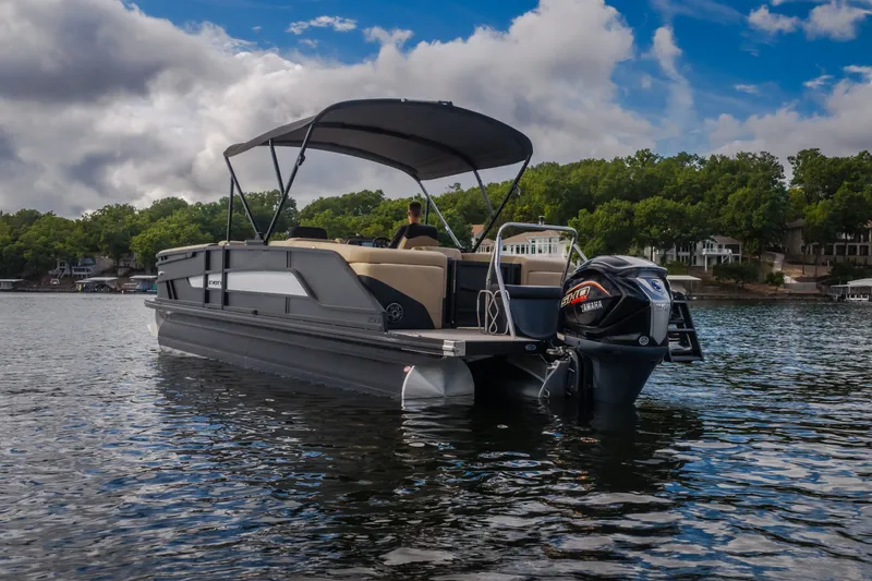 Slide: The Image of Evotti 525QL 2026 pontoon boat on a lake with Yamaha outboard motor. - 46