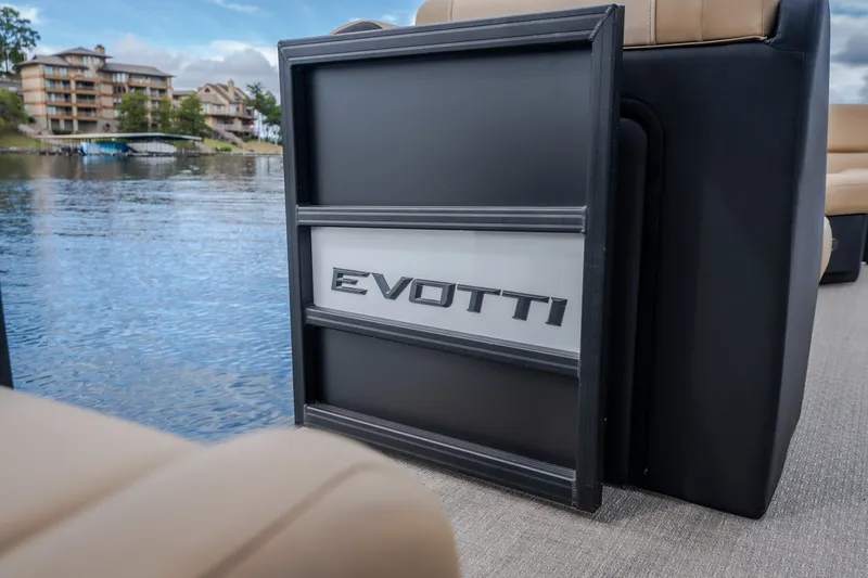 Slide: The Image of 2026 Evotti 525QL boat interior with logo, near waterfront buildings. - 41