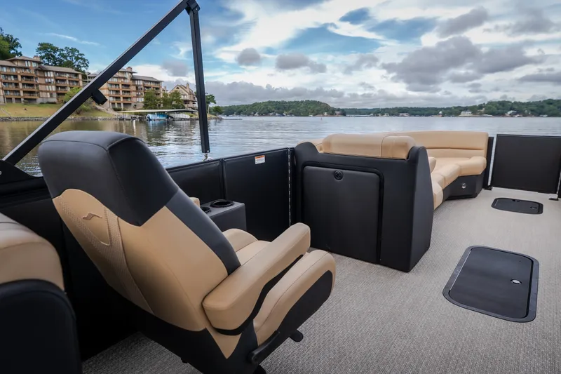 Slide: The Image of Luxurious Evotti 525QL pontoon boat interior, 2026 model, with plush seating on a serene lake. - 39