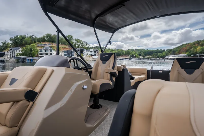Slide: The Image of 2026 Evotti 525QL boat interior with luxurious seating on a scenic lake. - 19