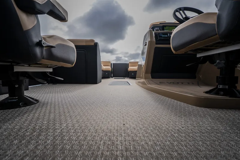 Slide: The Image of Interior view of 2026 Evotti 525QL boat, featuring plush seating and modern dashboard. - 43