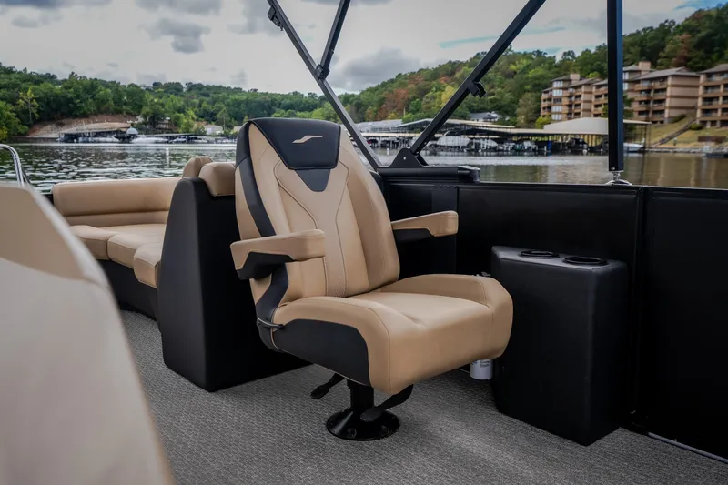 Slide: The Image of Luxurious seating on 2026 Evotti 525QL boat, with scenic lake view in background. - 26