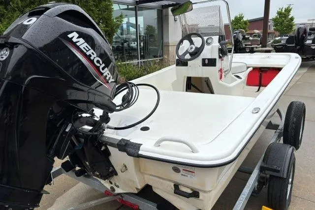 Slide: The Image of 2025 Mako Pro Skiff 13 CC boat with Mercury engine on trailer. - 10