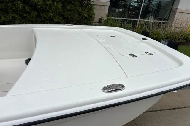 Slide: The Image of 2025 Mako Pro Skiff 13 CC boat, white deck, sleek design, outdoor display. - 11