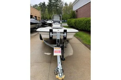 Slide: The Image of 2025 Mako Pro Skiff 13 CC boat on trailer, parked outdoors. - 3