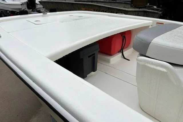 Slide: The Image of 2025 Mako Pro Skiff 13 CC boat deck with storage compartments and seating. - 9