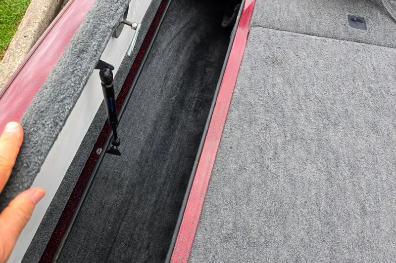Slide: The Image of Interior view of a 1995 Ranger R72 Sport boat storage compartment with gray carpeting. - 15