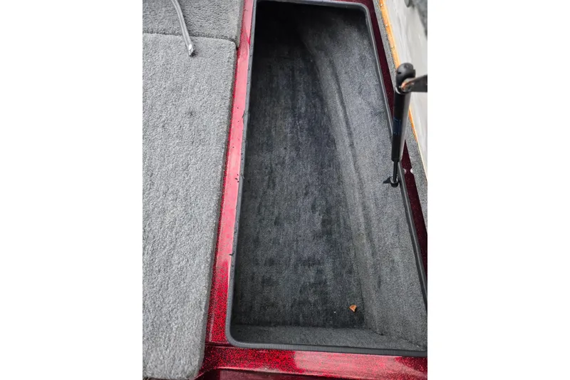 Slide: The Image of Open storage compartment in a 1995 Ranger R72 Sport boat. - 16