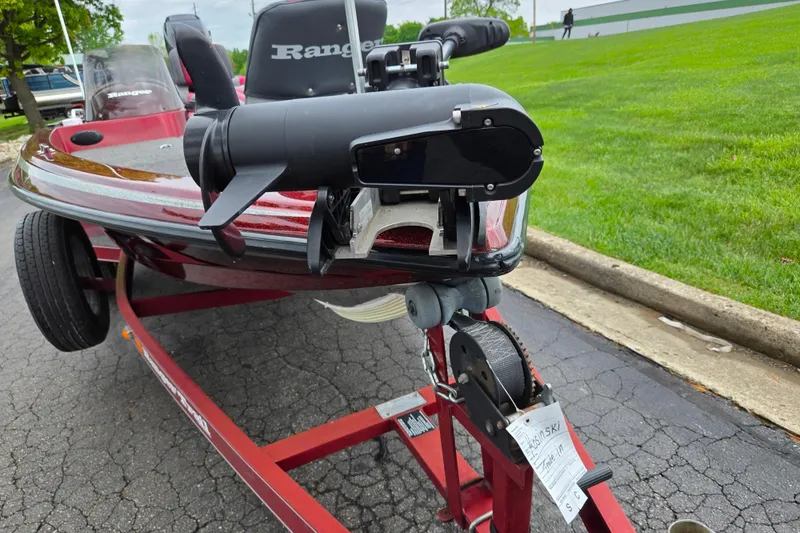 Slide: The Image of 1995 Ranger R72 Sport boat on trailer, parked on asphalt near grassy area. - 6