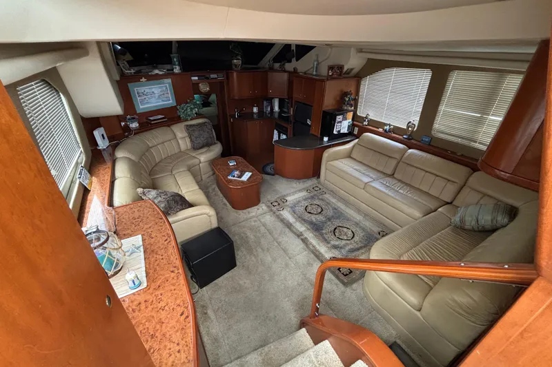 Slide: The Image of Luxurious interior of a 2007 Silverton 43 Motor Yacht with plush seating and elegant decor. - 14