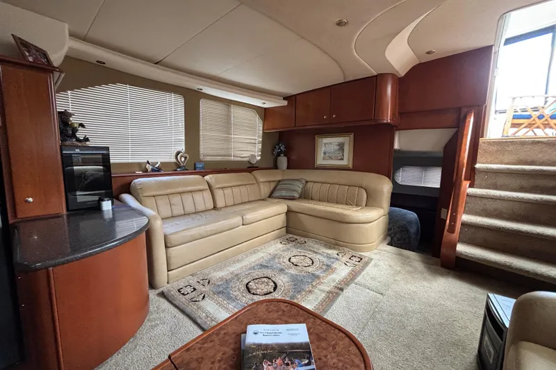 Slide: The Image of Luxurious interior of a 2007 Silverton 43 Motor Yacht with plush seating and elegant decor. - 16