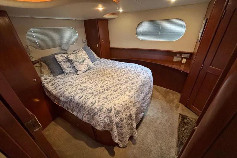 Slide: The Image of Luxurious bedroom interior of 2007 Silverton 43 Motor Yacht with elegant bedding. - 18