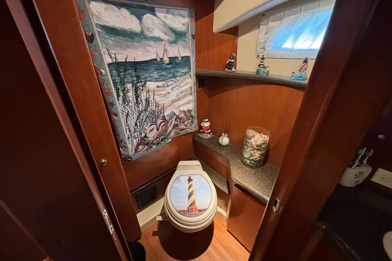 Slide: The Image of Bathroom interior of 2007 Silverton 43 Motor Yacht with nautical decor and tapestry. - 21