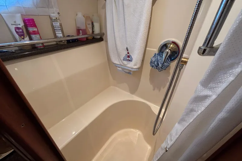 Slide: The Image of Bathroom of 2007 Silverton 43 Motor Yacht with shower and toiletries. - 22