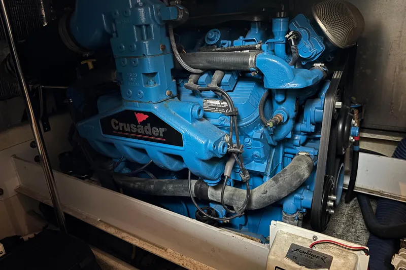 Slide: The Image of Engine of a 2007 Silverton 43 Motor Yacht, featuring a blue Crusader motor. - 28