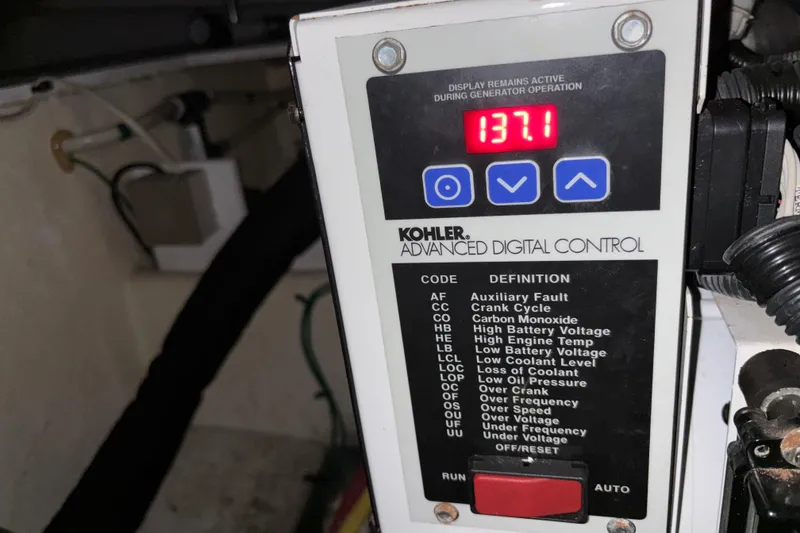 Slide: The Image of Kohler advanced digital control panel on 2007 Silverton 43 Motor Yacht displaying 137.1 volts. - 33