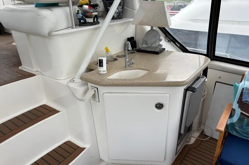 Slide: The Image of 2007 Silverton 43 Motor Yacht interior with sink, countertop, and decorative lamp. - 7