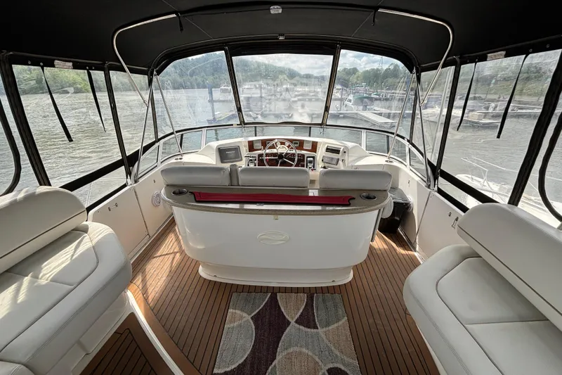 Slide: The Image of Interior view of 2007 Silverton 43 Motor Yacht with helm and seating area. - 9