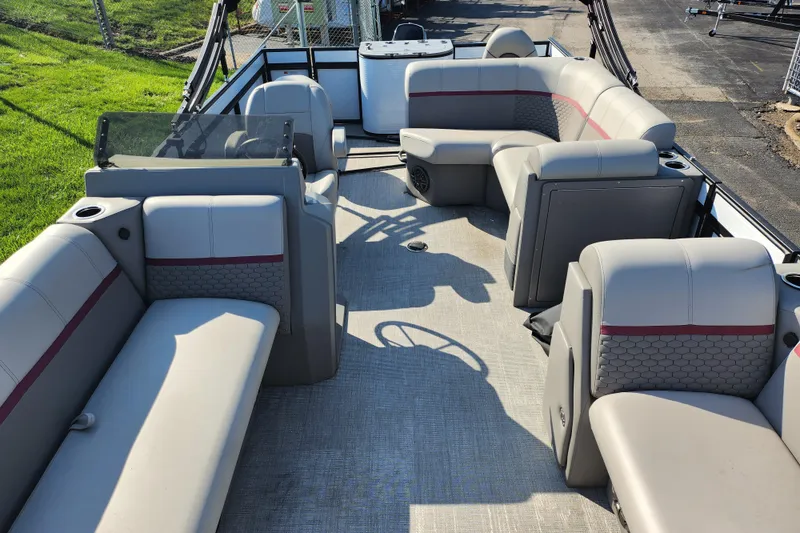 Slide: The Image of 2024 Qwest Angler Qwest XRE pontoon boat interior with spacious seating and modern design. - 11