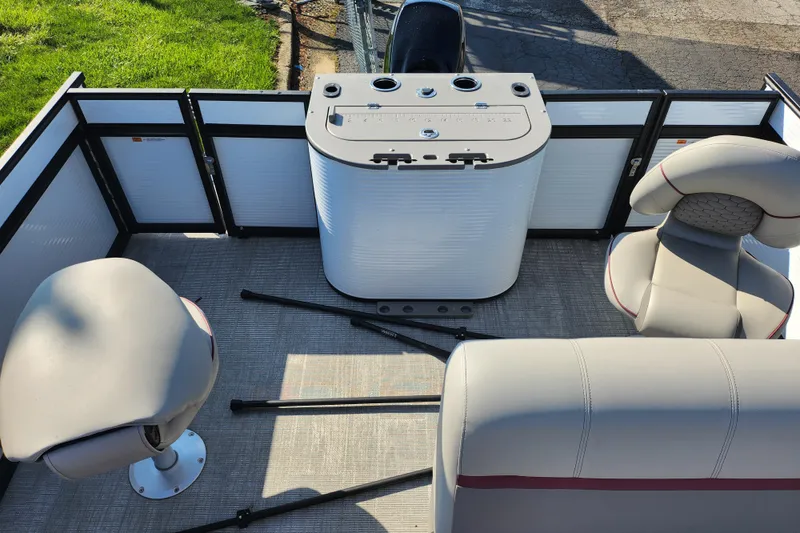 Slide: The Image of 2024 Qwest Angler Qwest XRE boat interior with seating and control panel. - 15