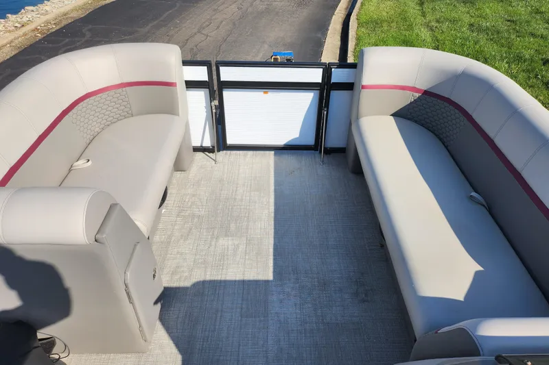 Slide: The Image of 2024 Qwest Angler Qwest XRE pontoon boat interior with spacious seating and modern design. - 22
