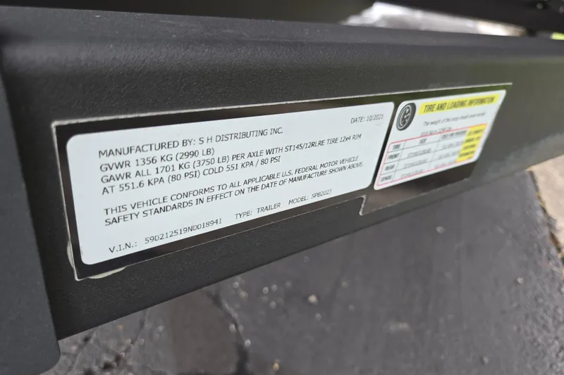 Slide: The Image of Label on 2024 Qwest Angler Qwest XRE trailer showing weight and tire specifications. - 24
