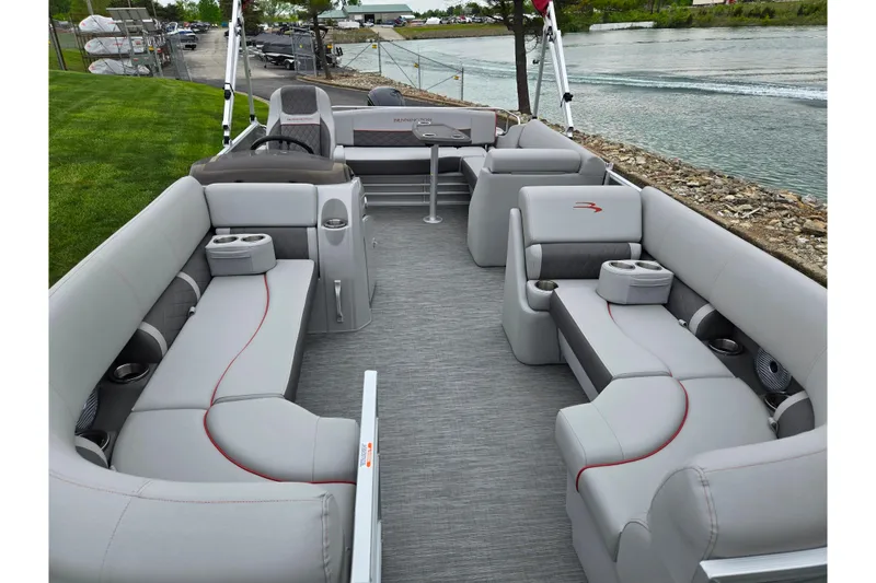 Slide: The Image of 2023 Bennington 22 LSB pontoon boat interior with luxurious seating and cup holders. - 11