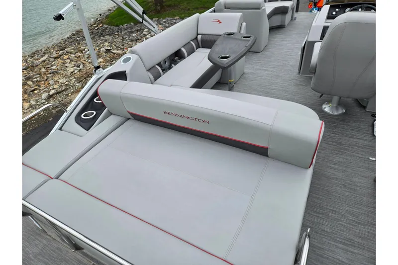 Slide: The Image of 2023 Bennington 22 LSB pontoon boat interior with luxurious seating and cup holders. - 18