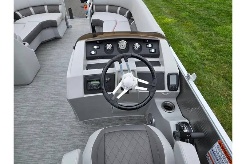 Slide: The Image of 2023 Bennington 22 LSB boat interior with steering wheel and control panel. - 20