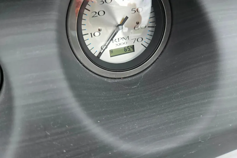 Slide: The Image of Close-up of 2023 Bennington 22 LSB RPM gauge displaying 6.5. - 21