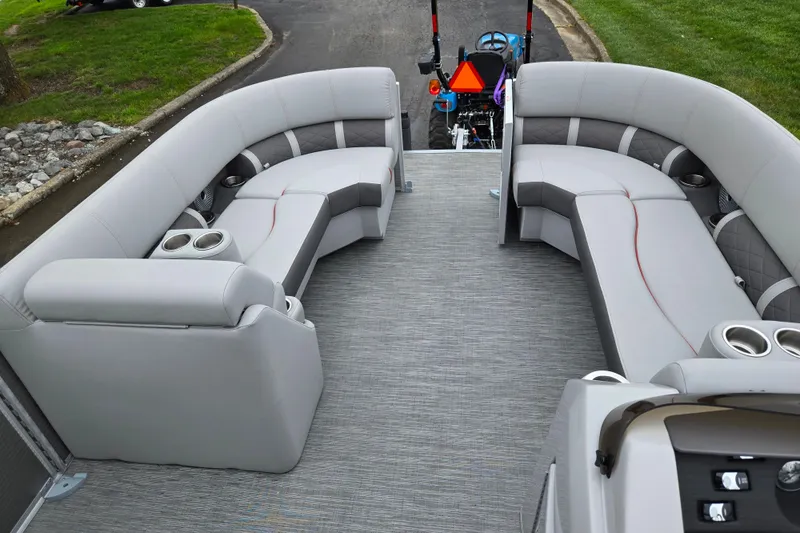 Slide: The Image of 2023 Bennington 22 LSB pontoon boat interior with plush seating and cup holders. - 22