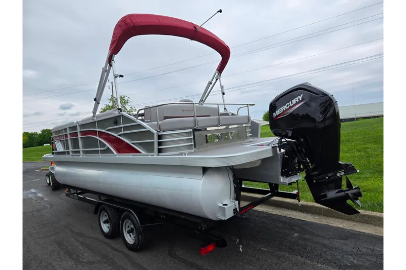 Slide: The Image of 2023 Bennington 22 LSB pontoon boat with Mercury outboard motor on trailer. - 3