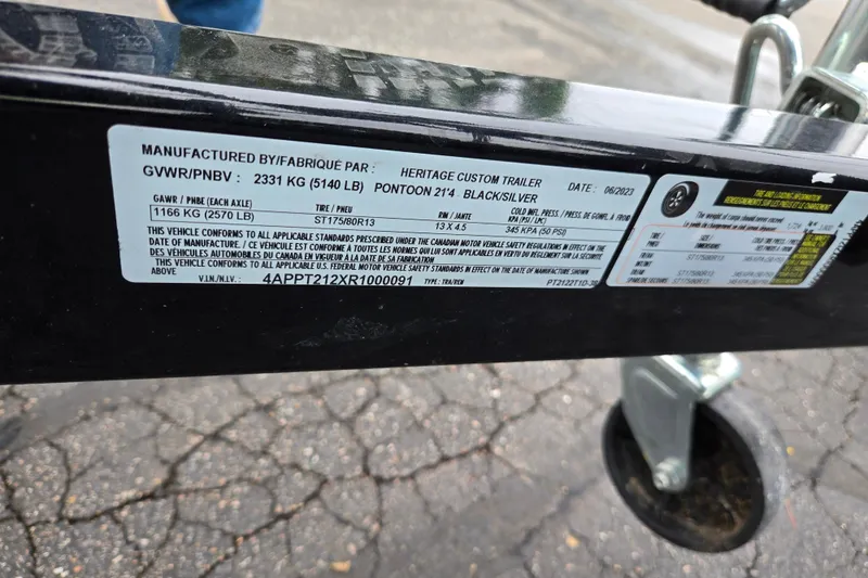 Slide: The Image of Label on a 2023 Bennington 22 LSB trailer, detailing specifications and compliance information. - 8