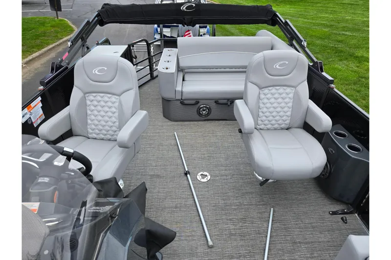 Slide: The Image of 2022 Crest Classic DLX 220 boat interior with plush gray seating and modern design. - 10