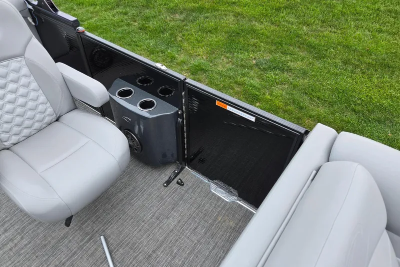 Slide: The Image of 2022 Crest Classic DLX 220 boat interior with gray seating and cup holders. - 11