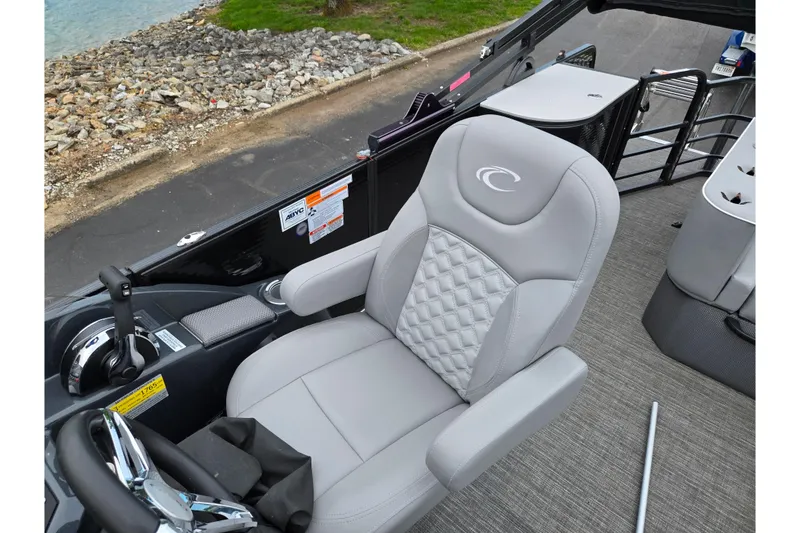 Slide: The Image of Captain's chair on 2022 Crest Classic DLX 220 boat, featuring sleek design and comfortable seating. - 12