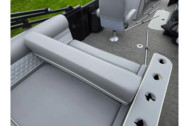 Slide: The Image of 2022 Crest Classic DLX 220 boat interior with gray seating and cup holders. - 15