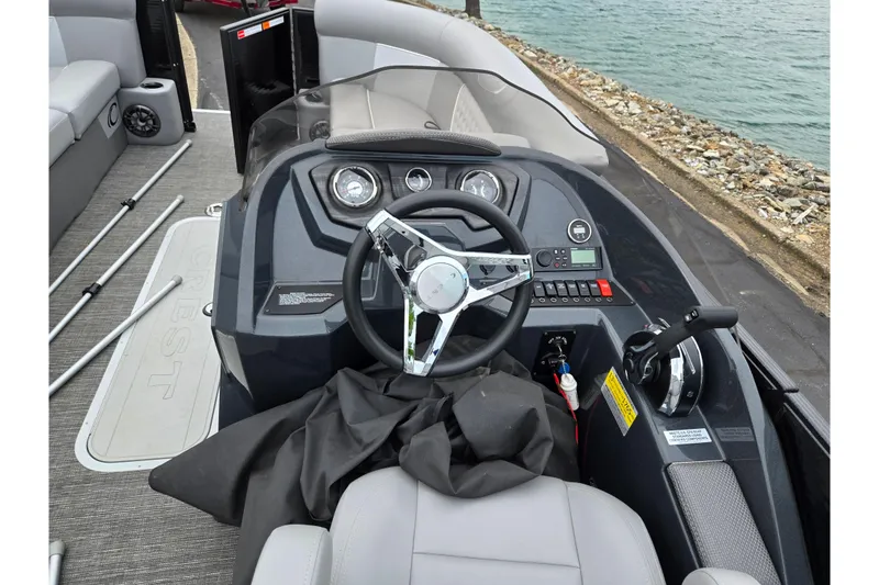 Slide: The Image of Cockpit view of 2022 Crest Classic DLX 220 boat with steering wheel and controls. - 19