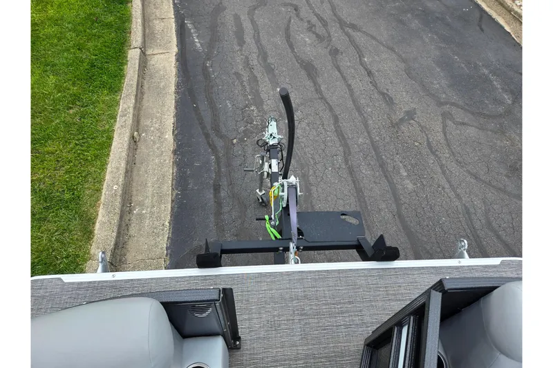 Slide: The Image of Top view of a 2022 Crest Classic DLX 220 boat trailer on a paved road. - 24