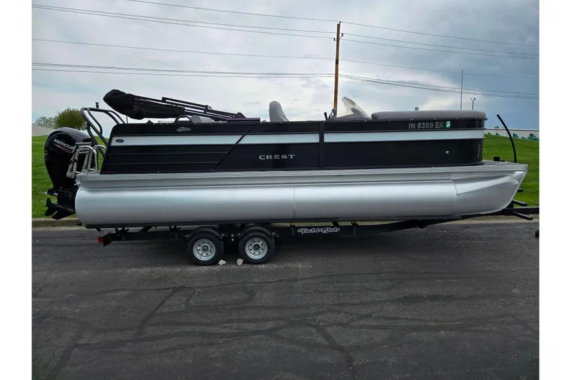 Slide: The Image of 2022 Crest Classic DLX 220 pontoon boat on trailer, side view. - 3