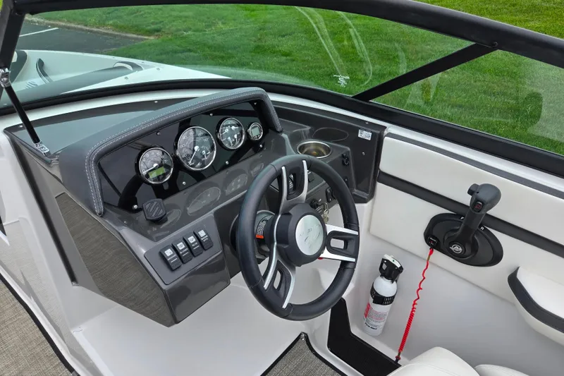 Slide: The Image of Cockpit of 2020 Monterey M-20 boat with steering wheel, gauges, and controls. - 13