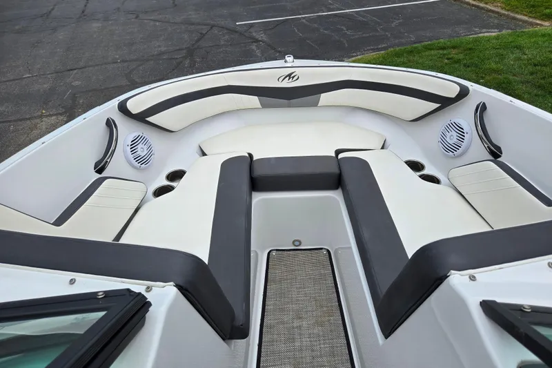 Slide: The Image of 2020 Monterey M-20 boat interior with cushioned seating and built-in speakers. - 17