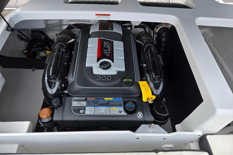 Slide: The Image of Engine compartment of a 2020 Monterey M-20 boat featuring a Mercury 4.5L engine. - 24